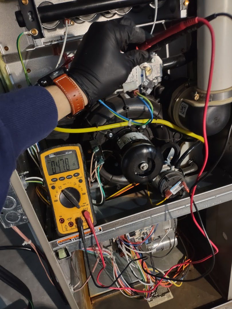 Furnace being tuned up - in Lambertville’s colder months, trust your furnace and comfort to Shamy Heating & Air Conditioning. Call now!