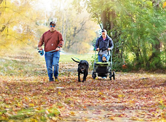 A family and their dog enjoy a fall walk in a Rossford. Don’t wait to make your family comfortable! Call Shamy now.